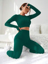 SHEIN Sport Studio طقم رياضي للنساء متكامل من بنطلون وبلوزة بأكمام طويلة، قطعتان من قماش مطاطي ذو لون واحد خالي من التفاصيل