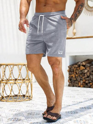 Manfinity Homme شورت رجالي فضفاض مكون من خيط ورقعة بشعارات، شورت رجالي صيفي عادي، ملابس رجالية