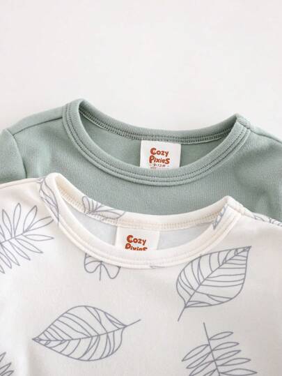 Cozy Pixies 4 قطع مجموعة بيجامات مريحة للأولاد الرضع: توب أكمام طويلة رقبة دائرية لون سادة من نسيج مرن وبنطلون خصر مطاطي، توب أكمام طويلة رقبة دائرية بطبعة زهرية وبنطلون خصر مطاطي