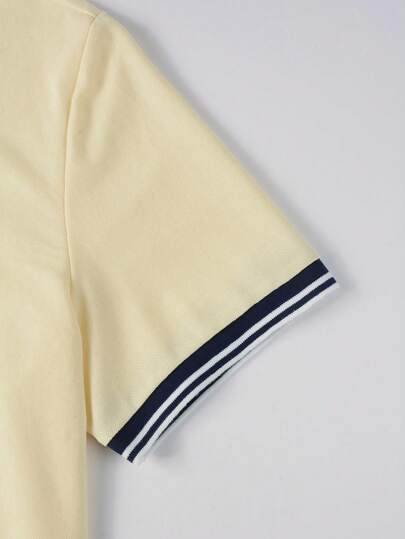 Manfinity Homme قميص بولو كاجوال قصير الأكمام للرجال باللون الأحادي مع لوحة أمامية مزينة بإضافات ومحبوك من الأمام