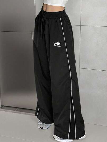 SHEIN بناطيل طويلة سوداء للمراهقات مع خطوط جانبية ورباط للخصر