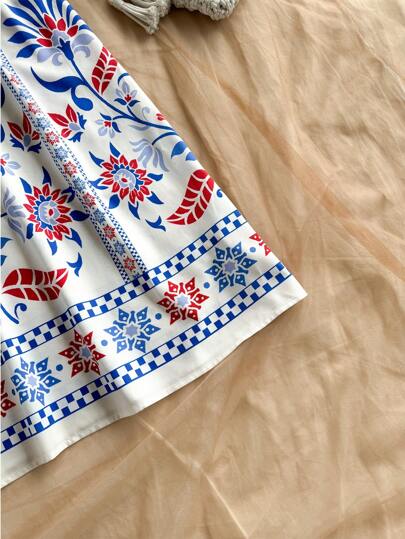 Soleia فستان عطلة منتصف الطول بياقة على شكل v وظهر مكشوف ومزين بربطة أمامية وطباعة