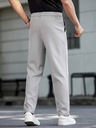 Manfinity Homme بنطلون كاجوال مخصر للرجال بجيب ورباط خصر بلون واحد