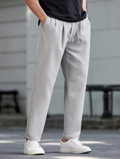 Manfinity Homme بنطلون كاجوال مخصر للرجال بجيب ورباط خصر بلون واحد