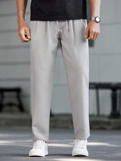 Manfinity Homme بنطلون كاجوال مخصر للرجال بجيب ورباط خصر بلون واحد