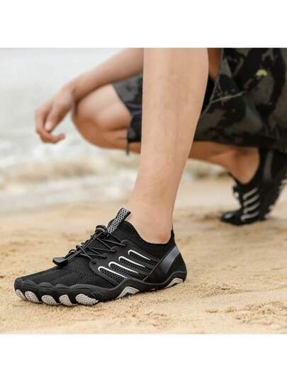 بوت رجالية للإستخدام الخارجي مقاومة للانزلاق من المطاط الأسود بتصميم شبكي مع نظام ربط الحذاء