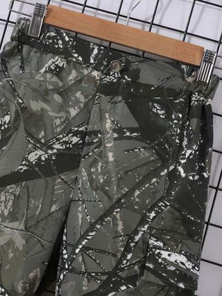 SHEIN بناطيل فضفاضة مع جيب حمولة مطبوعة بنمط الزهور الخضراء للمراهقين