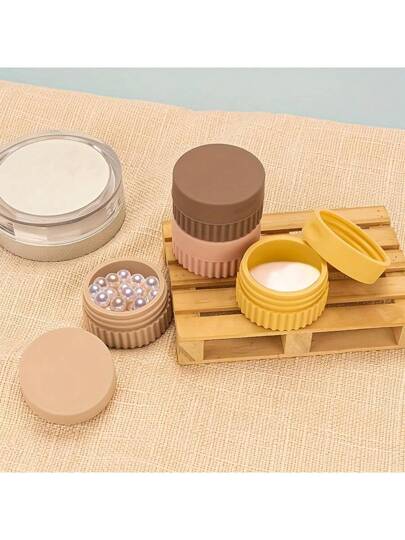 حاوية سفر سيليكون قطعة واحدة: مانع للتسرب، قابل لإعادة الاستخدام، وكاملة لتخزين كريم اليدين، كريم الجسم، والمجوهرات