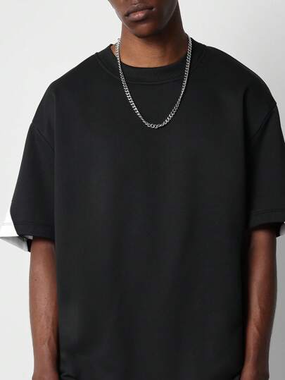 SUMWON قميص جرافيك كاجوال بطباعة خلفية أوفر سايز بشعار الألوان الرياضية بأسلوب فارسيتي للموضة الحضرية للشارع في برووكلين