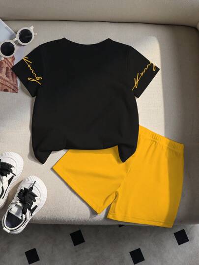 طقم بنطلون قصير وقميص أسود بياقة دائرية وطباعة شعار الملك للأطفال الرضع والصغار، إطلالة كاجوال