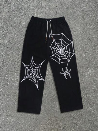 Yemwry بنطلون كاجوال رجالي أسود بخصر مرن. يتميز البنطلون بتصميم أنماط عنكبوت وشبكة عنكبوت بيضاء، بتصميم فريد يجمع بين العناصر الداكنة والفريدة. مناسب لمن يبحثون عن الموضة المخصصة، لخلق إطلالة أسلوب الشارع أو المظهر الجمالي الداكن.