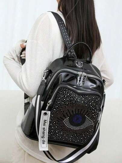 1 حقيبة ظهر عصرية رجعية بلون أسود مزينة بحلقات معدنية ودبابيس مركزية للأسلوب الحضري المتنوع للجنسين