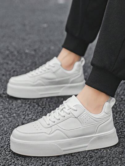 حذاء رياضي رمادي أحادي اللون للرجال بنمط السكيت بورد، برباط أمامي، تصميم ذو تفاصيل زخرفية بشكل بتشوورك ، رأس مستدير، منخفض الرقبة، رياضي