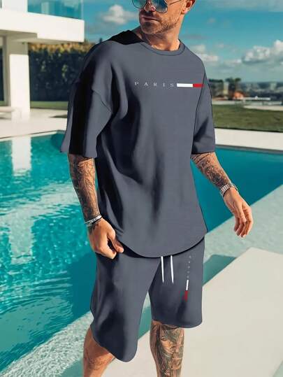 Manfinity Homme طقم تيشيرت وشورت كاجوال مطبوع عليه حروف للرجال في الصيف