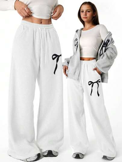 SHEIN بنطلون رياضي مستقيم كبير الحجم مع رسومات العقدة للبنات