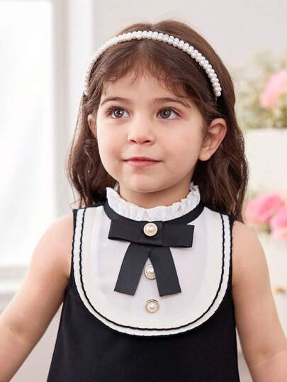 فساتين بيبي فستان أنيق وجذاب لطفلة بتصميم لوني باللون الأبيض والأسود محلى بفيونكة