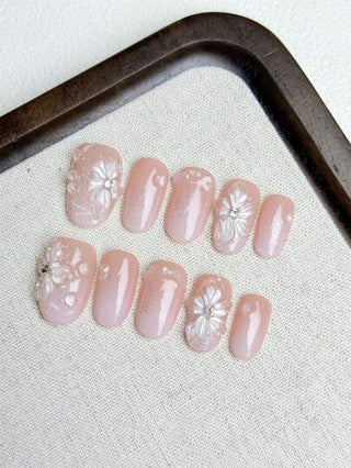 مجموعة أظافر اصطناعية DIY من 10 قطع، مشغولة يدوياً بشكل زهرة السوسن شفافة كالجليد ذات سطح تدرج وردي وتزيينات قطرات مائية غير متماثلة. بعد الارتداء تجعل اليدين أكثر نضارة وأناقة وبساطة ساحرة. المجموعة تشمل 1 ظفر اصطناعي، 1 جل و1 مبرد أظافر. مناسبة...