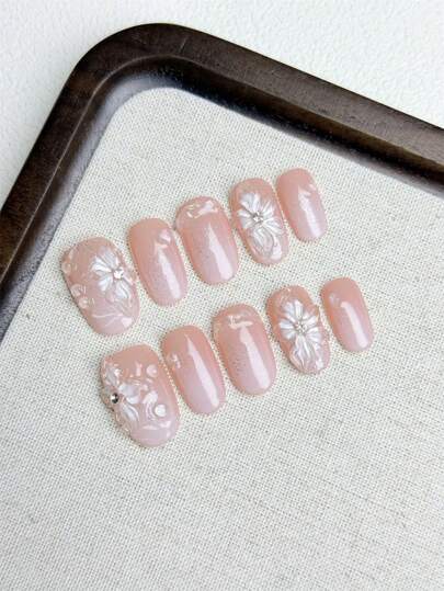 مجموعة أظافر اصطناعية DIY من 10 قطع، مشغولة يدوياً بشكل زهرة السوسن شفافة كالجليد ذات سطح تدرج وردي وتزيينات قطرات مائية غير متماثلة. بعد الارتداء تجعل اليدين أكثر نضارة وأناقة وبساطة ساحرة. المجموعة تشمل 1 ظفر اصطناعي، 1 جل و1 مبرد أظافر. مناسبة...