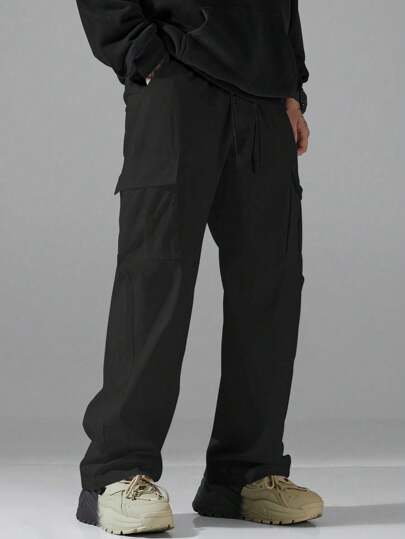 Manfinity Hypemode بنطلون كاجوال رجالي سليم بخطوط مستقيمة وفضفاض من اللون الأحادي