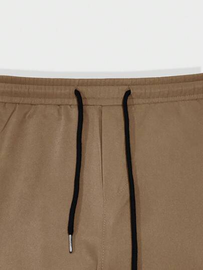 Manfinity Hypemode بنطلون مسستقيم من الجيوب بخصر رباط، بلون أحادي، بأسلوب كاجوال وبنطلون أحمال شحنة معتدل