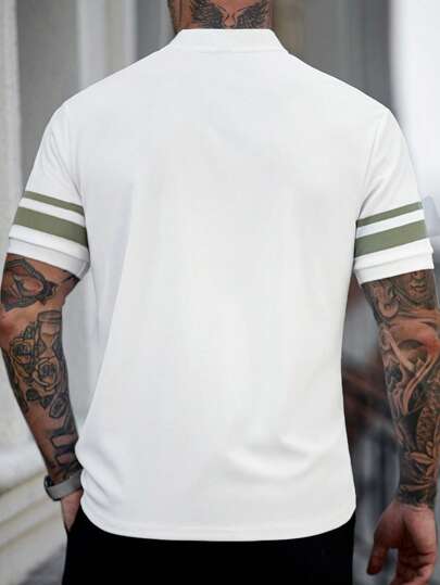 Manfinity Mode قميص بولو كاجوال بياقة عالية وأكمام قصيرة مخطط وبألوان مجمعة، صيفي