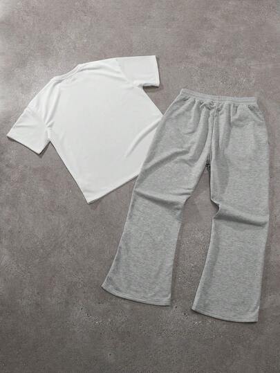 Manfinity Hypemode طقم تيشيرت كاجوال قصير الأكمام بطبعة حرفية على الرقبة المستديرة وبنطال رياضي بخصر رباط والساقين واسعتين، ملابس كاجوال للرجال مناسبة للارتداء اليومي، الخروج، الحفلات، المهرجانات الموسيقية، لقاء الأصدقاء، ويمكن استخدامها كهدية لأصدقاء وعا