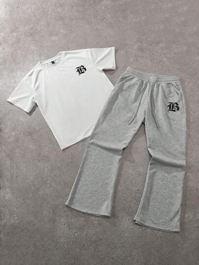 Manfinity Hypemode طقم تيشيرت كاجوال قصير الأكمام بطبعة حرفية على الرقبة المستديرة وبنطال رياضي بخصر رباط والساقين واسعتين، ملابس كاجوال للرجال مناسبة للارتداء اليومي، الخروج، الحفلات، المهرجانات الموسيقية، لقاء الأصدقاء، ويمكن استخدامها كهدية لأصدقاء وعا