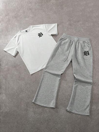 Manfinity Hypemode طقم تيشيرت كاجوال قصير الأكمام بطبعة حرفية على الرقبة المستديرة وبنطال رياضي بخصر رباط والساقين واسعتين، ملابس كاجوال للرجال مناسبة للارتداء اليومي، الخروج، الحفلات، المهرجانات الموسيقية، لقاء الأصدقاء، ويمكن استخدامها كهدية لأصدقاء وعا