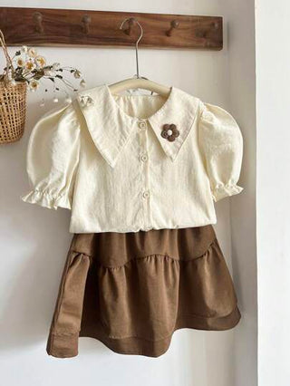 girls-sets Vintaside Kids طقم للبنات من قميص قصير الأكمام مناسب للصيف مع تنورة غربية عصرية وجذابة مثالي للموسم الصيفي. التصميم عملي وأنيق، يوفر الدفء والأناقة للخارج أو وقت الراحة في المنزل