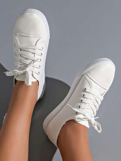 زوج من أحذية الكانفس الرياضية الخفيفة الوزن والمريحة للنساء، قابلة للتنفس وذات استخدامات متعددة، مناسبة لجميع المواسم - الصيف