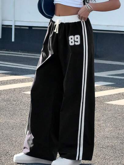 SHEIN بنطلون بقصة فضفاضة للمراهقات مطبوع بطريقة الكتل اللونية عريض الساق، ملابس كاجوال للعطلات والشارع ،للربيع والصيف