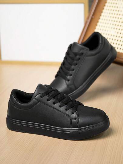 أحذية كلاسيكية للرجال بلون أحادي من جلد العلوي مع ربطة، برؤوس مستديرة وبدون كعب، بتصميم بسيط وعملي للاستخدام اليومي للتنقل والأعمال والملابس الكاجوال