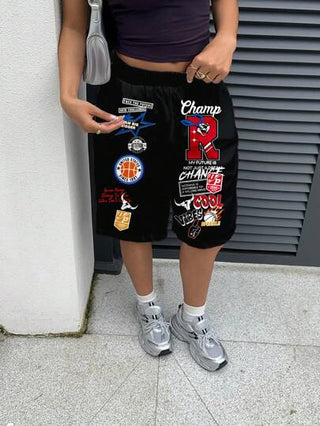 EZwear شورتات بخصر متوسط فضفاضة بتصميم ساق مستقيم وطول 7/10 مع جيوب مائلة