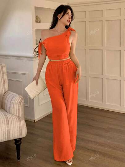 abyoxi طقم قطعتين برتقالي اللون مكون من ملابس علوية رقبة غير متماثلة وكتف مائل وربطة وخصر ضيق وبنطلون واسع الساق، أناقة كاجوال مناسبة للذهاب للعمل أو العطلات أو الشاطئ، ملابس نسائية جديدة للربيع والصيف