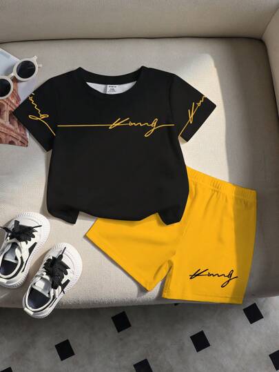 طقم بنطلون قصير وقميص أسود بياقة دائرية وطباعة شعار الملك للأطفال الرضع والصغار، إطلالة كاجوال