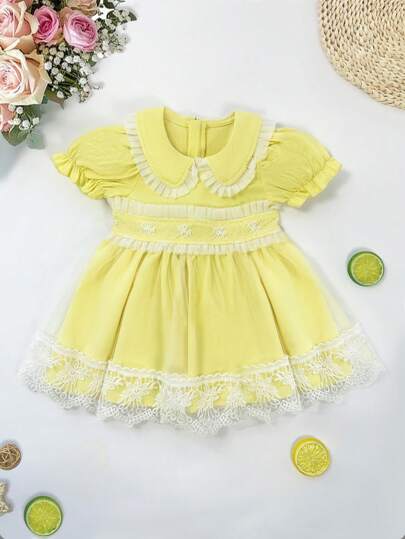 فساتين بيبي Souflis Souflis فستان صيفي للطفلة ذو طراز حلو باللون الأصفر، بأكمام قصيرة وطوق بيتر بان مع تريم من الدانتيل