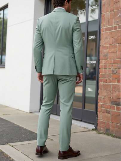 Manfinity Homme بدلة رجالية كاملة المقاس مكونة من جاكيت بياقة وأكمام طويلة ومزينة بتأثير البلي مع بنطلون من قطعة واحدة، بلون موحد