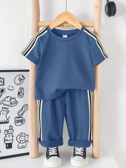 SHEIN طقم ملابس مكون من 2 قطعة (ملابس علوية وبنطلون) للأطفال الصغار, ملابس علوية بأكمام متساقطة وياقة مستديرة وبنطلون رياضي فضفاض ذو أربطة, نسيج محبوك ناعم وللموسم الربيع والصيف للارتداء داخل وخارج المنزل