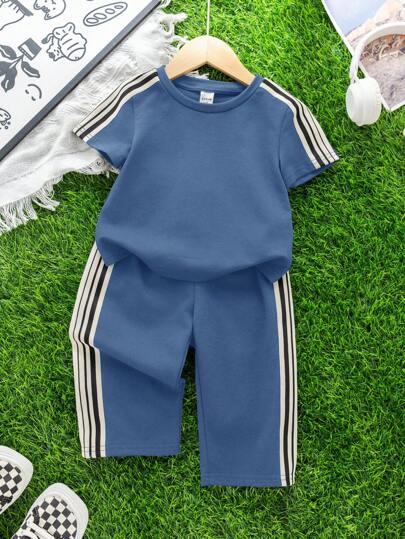 SHEIN طقم ملابس مكون من 2 قطعة (ملابس علوية وبنطلون) للأطفال الصغار, ملابس علوية بأكمام متساقطة وياقة مستديرة وبنطلون رياضي فضفاض ذو أربطة, نسيج محبوك ناعم وللموسم الربيع والصيف للارتداء داخل وخارج المنزل