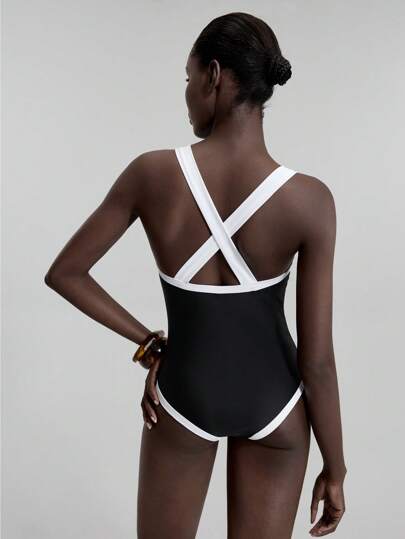 مايوه حريمي قطعة واحدة Ontre ملابس سباحة نسائية موديل جديد 2022، بدلة سباحة قطعة واحدة، باللون الأسود مع تباين لون المشمش، تصميم ظهر متقاطع ، كاجوال وأنيق ، ملابس شاطئ