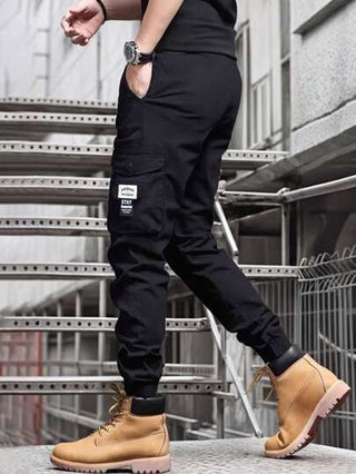 Manfinity Homme بنطلون كاجوال للرجال بخصر قابل للشد وخصر ايلاستيكي وجيوب للحمل