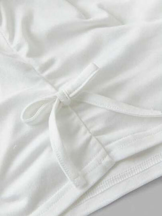 girls-sets Girlism مجموعة من قميص تريكو بأكمام قصيرة ياقة مستديرة ومطبوع بنقشة النمر ومزين بفيونكة، وبنطال تريكو طويل بقصة واسعة بطبعة النمر مكونة من 2 قطعة مناسبة للبنات المراهقات