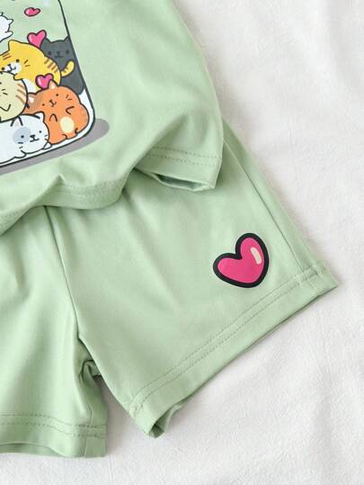 مجموعة من قطعتين لطفلة رضيعة/ صغيرة من عمر 0-3 سنوات، تتكون من تي شيرت كم قصير بطباعة قطة جميلة وشورت، بلون أخضر التفاح، ملابس ربيعية/صيفية للطفل