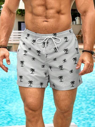 Manfinity Swimmode شورتات بشريط خصر مطبوعة برسوم أشجار النخيل ذات جيوب للرجال، طراز هاواي