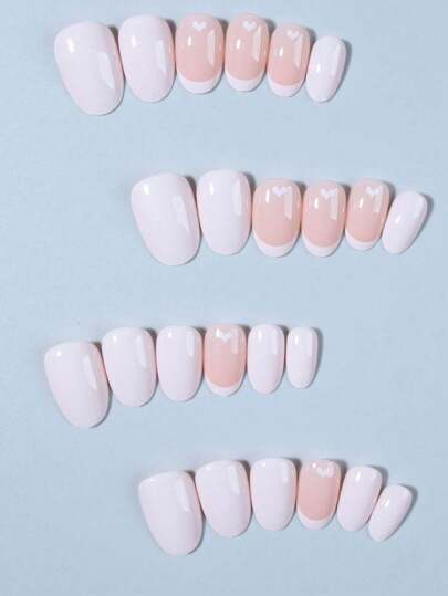 حول أظافرك ب 24 قطعة أظافر قصيرة بشكل بيضاوي قلب تصميم فرنسي ذات تأثير، طقم أظافر اصطناعية مناسبة تماماً، تشمل 1 قطعة غراء جيلي و 1 قطعة مبرد أظافر، مناسبة للنساء والفتيات لاستخدامهم في العمل والدراسة والأعياد