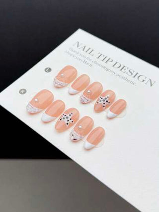 10 قطع من ألسنة الأظافر القصيرة ذات الشكل اللوزي اليدوية، بطراز أنيق وعصري، مزخرفة باللون الأبيض مع نقوش هيكل اللؤلؤ والنجوم على أرضية نقاط سوداء، بطريقة فرنسية غير منتظمة على قاعدة الأظافر ال- nude، مجموعة تزيين أظافر أنيقة للسيدات والفتيات
