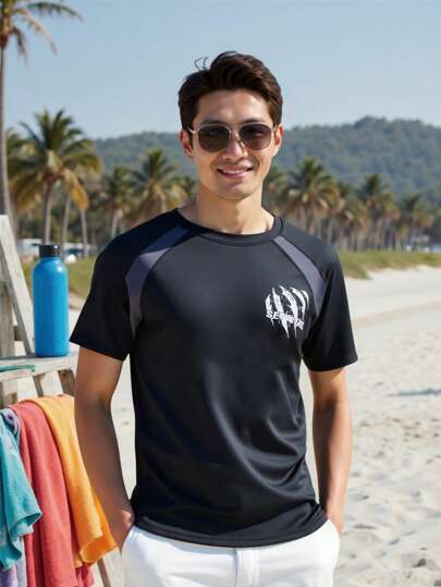 Manfinity Swimmode بذلة السباحة الرشاشة للرجال ذات اللون المتباين والرقعات، قصيرة الأكمام، واقية من الشمس والتزلج