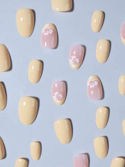 ارتقي بأناقتك مع مجموعة 24 قطعة أظافر مزيفة قصيرة بشكل بيضاوي مع أزهار وألوان ماكرون فرنسية، أظافر أكريليك مزيفة كاملة الملائمة ، تحتوي على 1 قطعة هلامي لاصق و 1 ملف أظافر، مناسبة للنساء والفتيات لاستخدامها في العمل اليومي والدراسة والحفلات