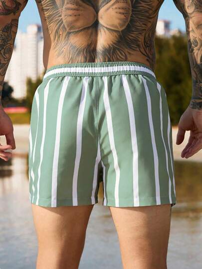 Manfinity Swimmode شورت شاطئ مقلم مع خصر بسحاب وجيوب مائلة ، شورت صيفي أسلوب العطلات للرجال، أسلوب هاواي