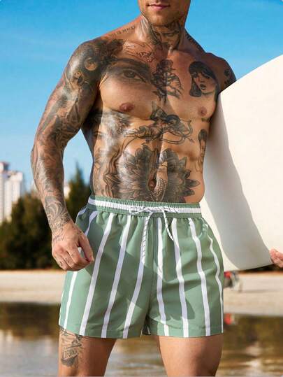 Manfinity Swimmode شورت شاطئ مقلم مع خصر بسحاب وجيوب مائلة ، شورت صيفي أسلوب العطلات للرجال، أسلوب هاواي